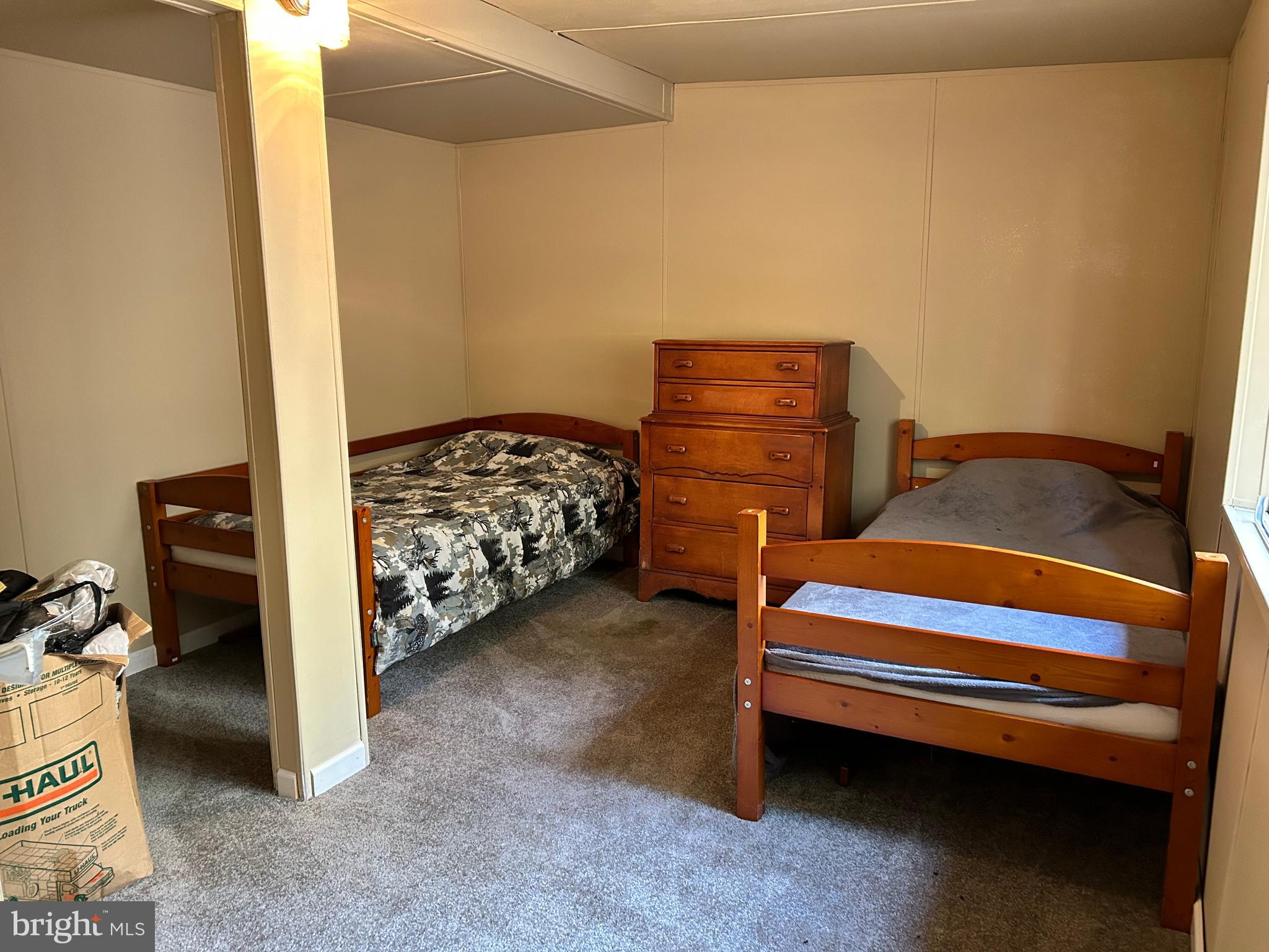 385 Elk Creek Road Aaronsburg, PA 16820 - Photo 44 of 89 a bedroom with two bunk beds and a chair