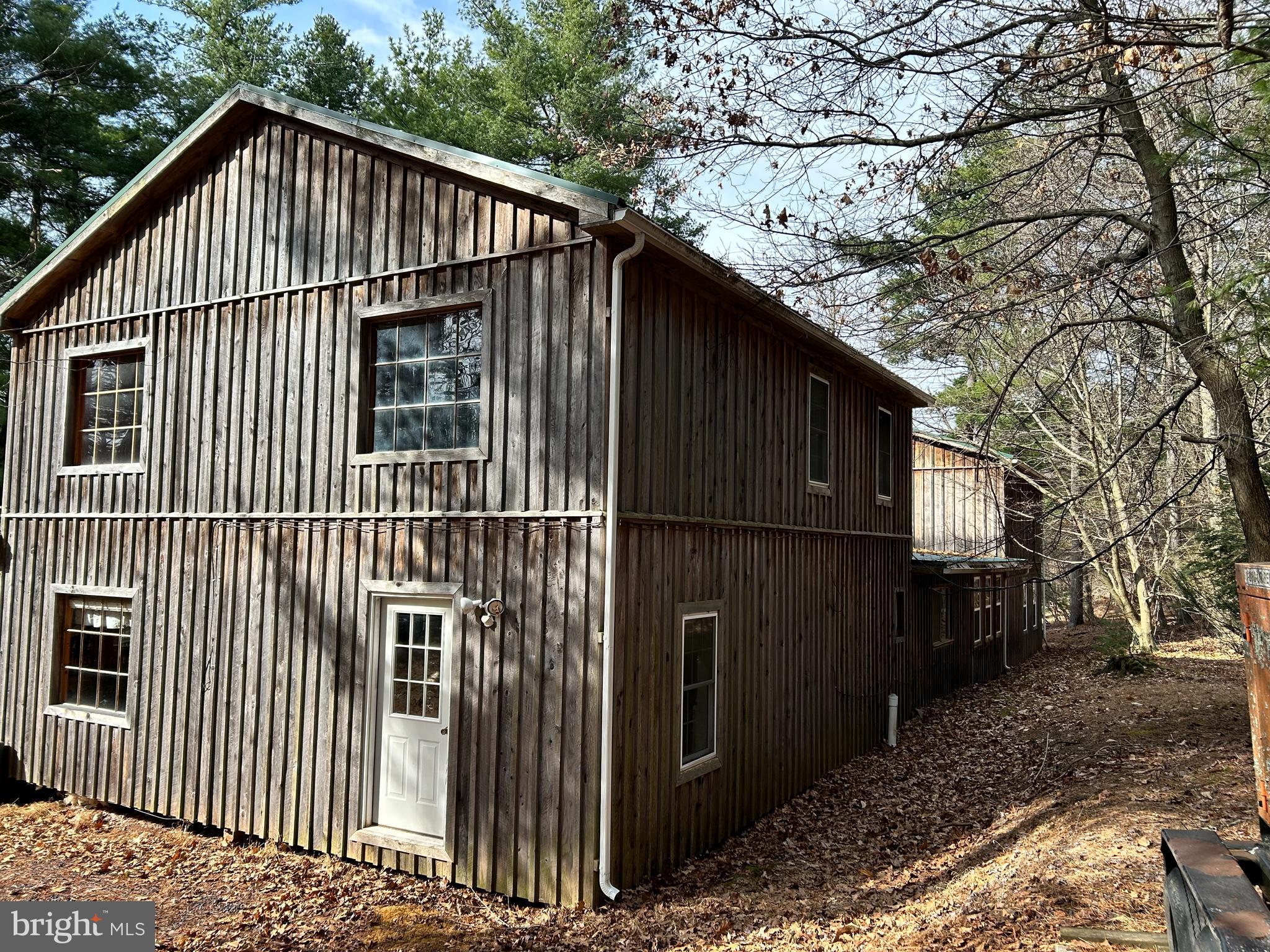 385 Elk Creek Road Aaronsburg, PA 16820 - Photo 54 of 89 a view of wooden house with a small yard