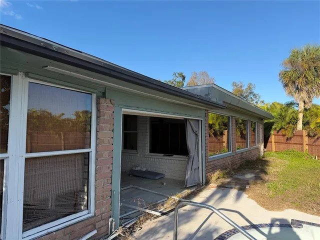 a view of a backyard with hardwood