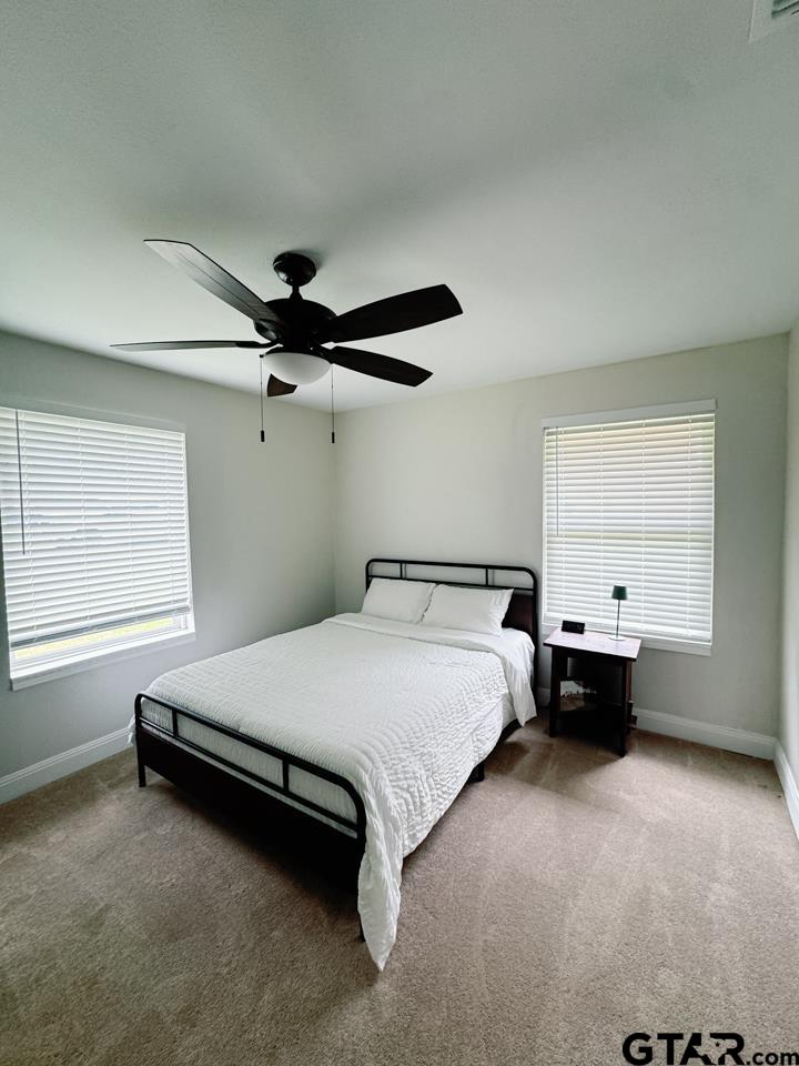 2411 Rodge Drive Tyler, TX 75701 - Photo 25 of 42 a bedroom with a bed and window
