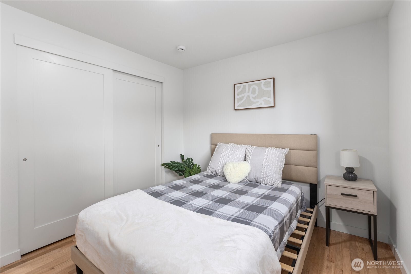 10646 Southeast 236th Street Kent, WA 98031 - Photo 14 of 20 a bedroom with a bed and a table in it