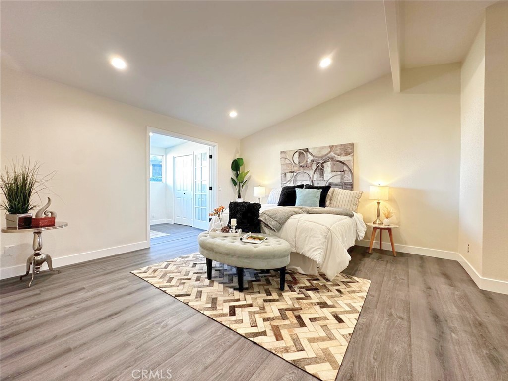 54838 El Prado Trail, Unit C7 Yucca Valley, CA 92284 - Photo 12 of 18 a living room with furniture a wooden floor and a potted plant