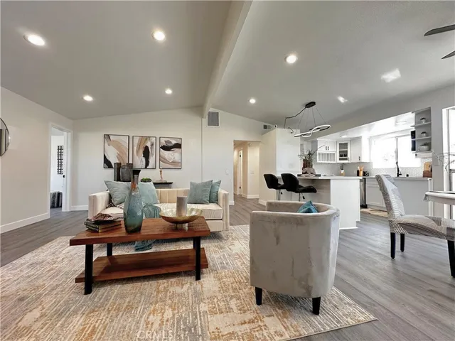 a living room with furniture and a table