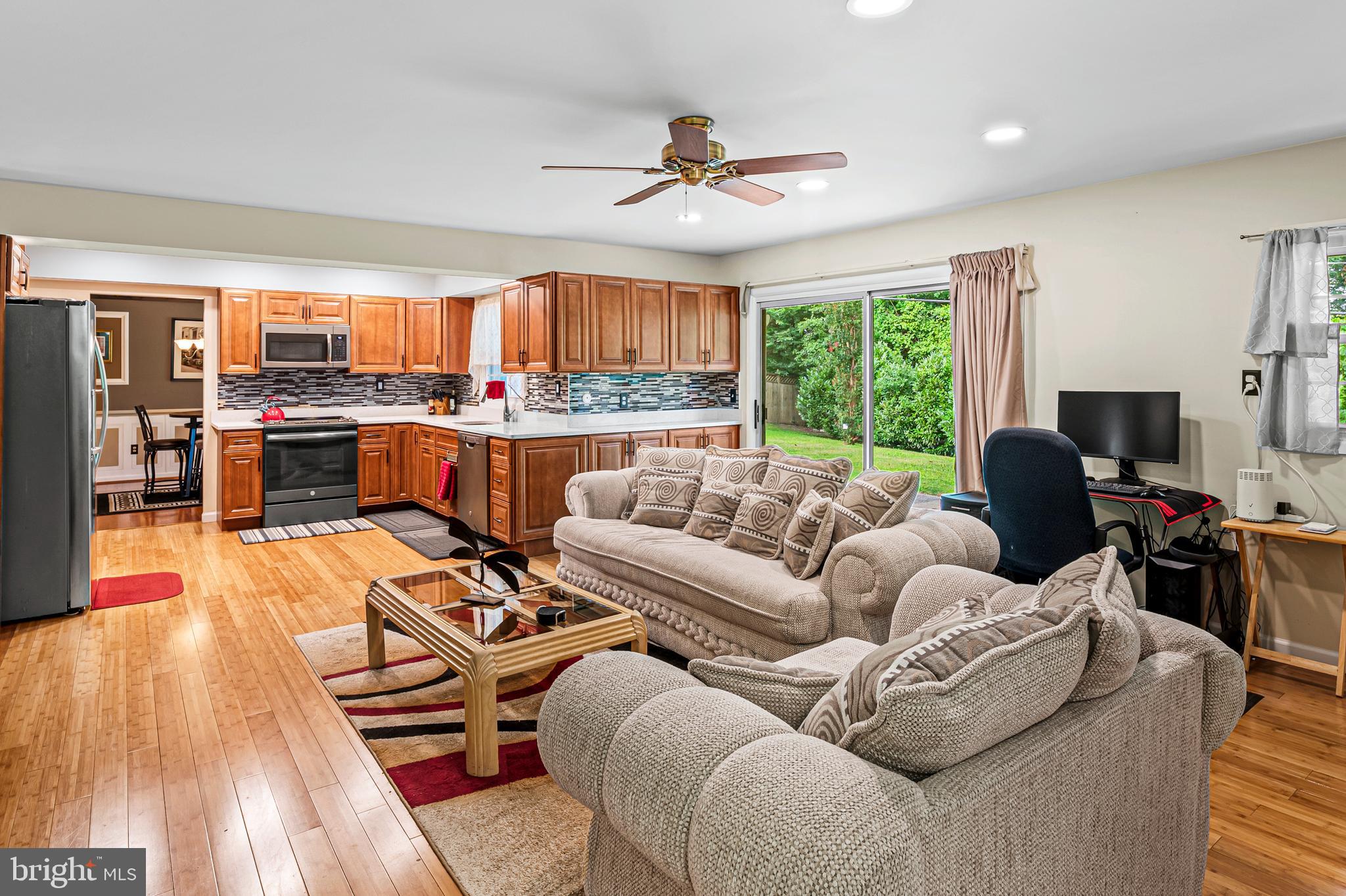 12128 Long Ridge Lane Bowie, MD 20715 - Photo 14 of 39 a living room with furniture and a large window
