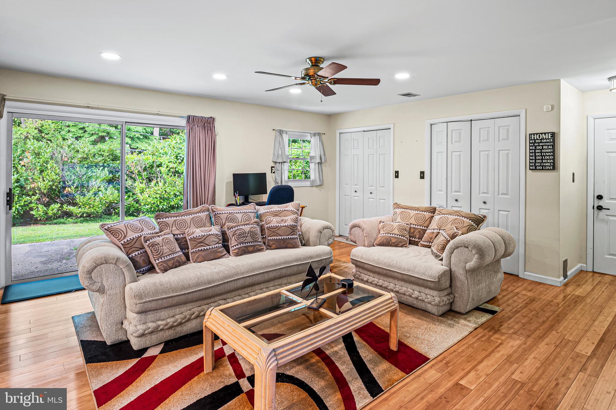 12128 Long Ridge Lane Bowie, MD 20715 - Photo 15 of 39 a living room with furniture a large window and a rug