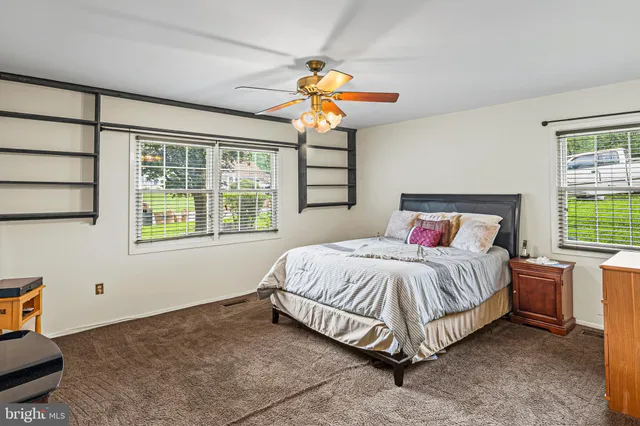 a bedroom with a bed and window