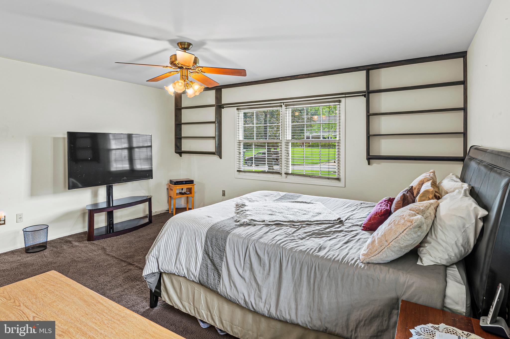 12128 Long Ridge Lane Bowie, MD 20715 - Photo 17 of 39 a bedroom with a bed and a flat screen tv