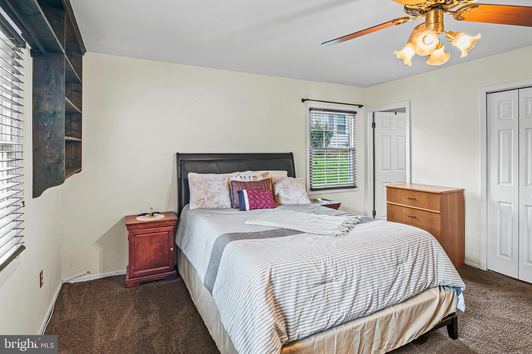 12128 Long Ridge Lane Bowie, MD 20715 - Photo 18 of 39 a bedroom with a bed and a chandelier