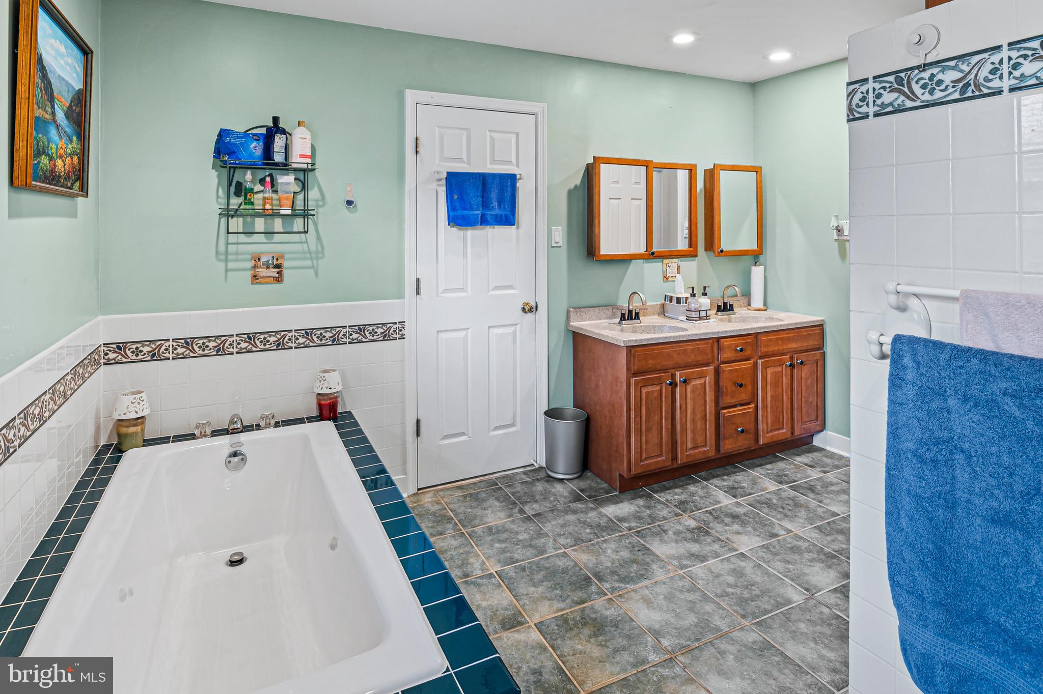 12128 Long Ridge Lane Bowie, MD 20715 - Photo 20 of 39 a view of kitchen with stainless steel appliances cabinets and wooden floor