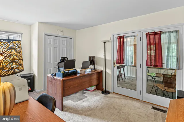 a workspace with furniture and window