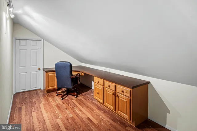 a view of workspace with wooden floor