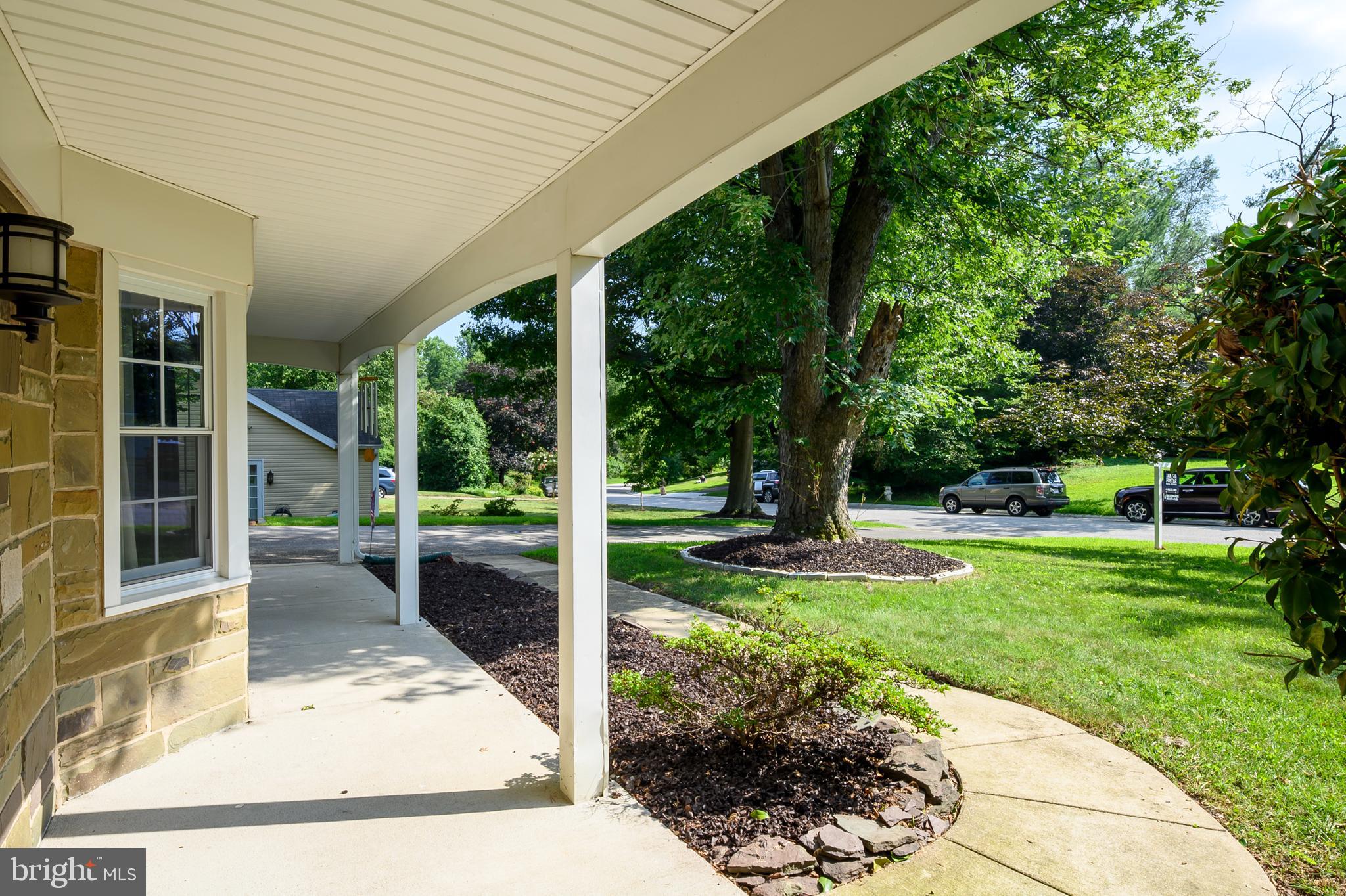 12128 Long Ridge Lane Bowie, MD 20715 - Photo 5 of 39 a view of a porch with a garden