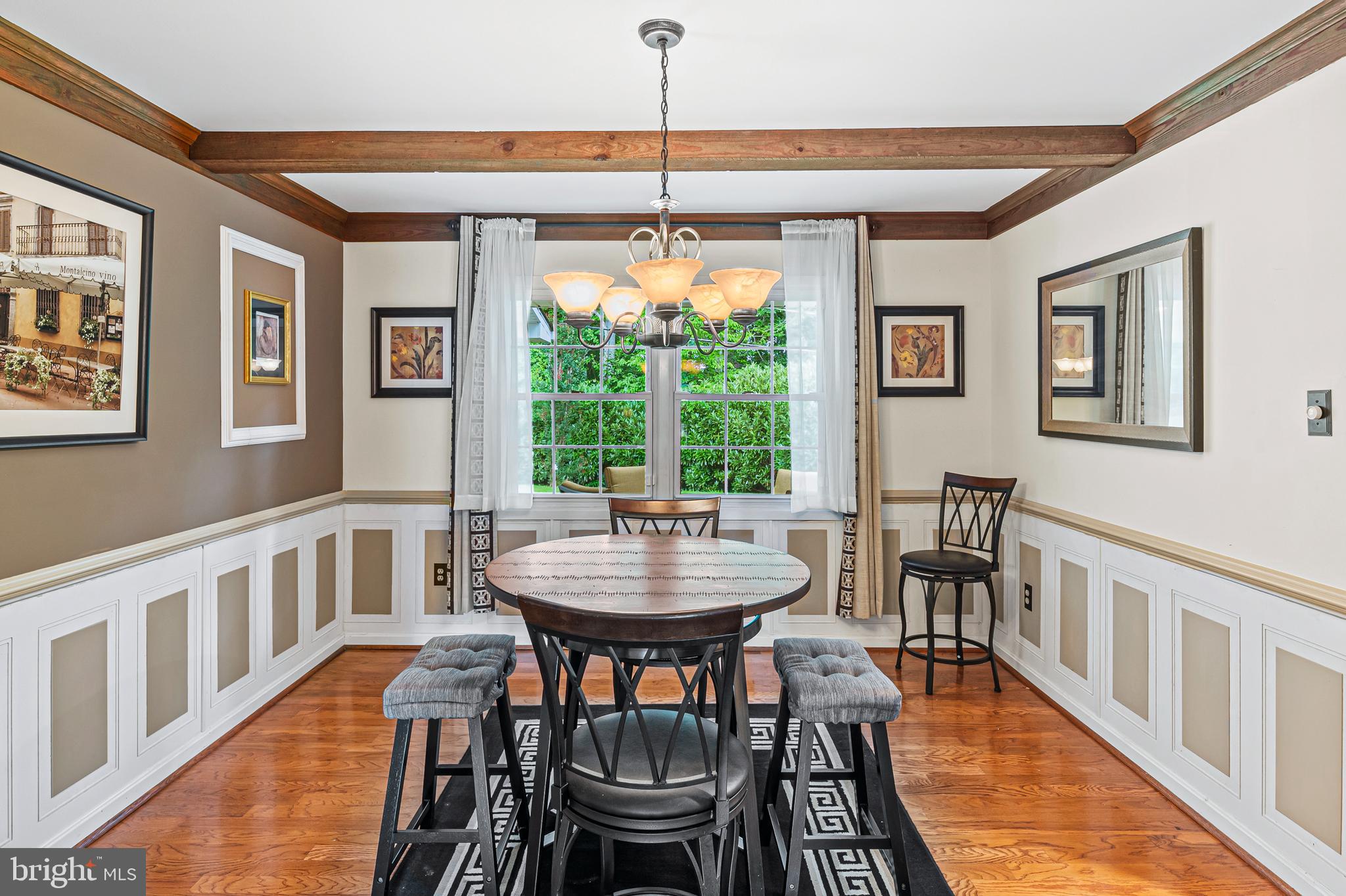 12128 Long Ridge Lane Bowie, MD 20715 - Photo 9 of 39 a view of a dining room with furniture window and wooden floor