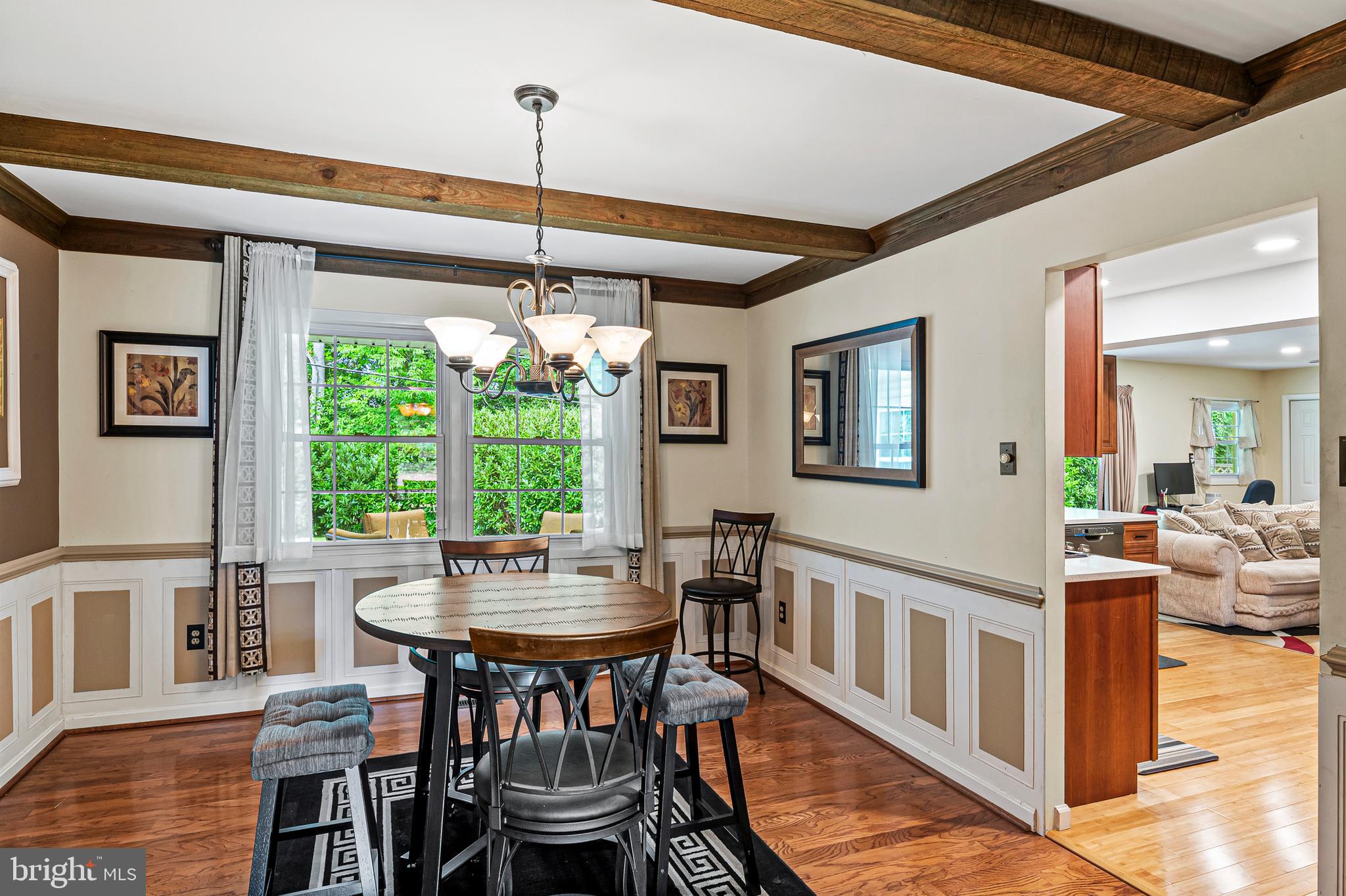 12128 Long Ridge Lane Bowie, MD 20715 - Photo 10 of 39 a view of a dining room with furniture window and wooden floor