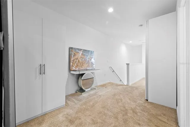 a bathroom with a granite countertop sink a toilet and a mirror