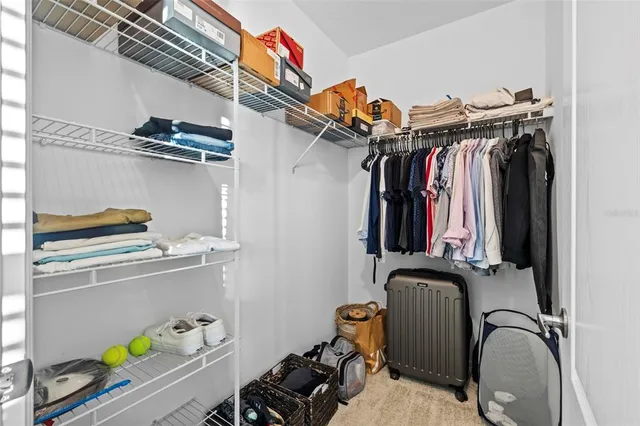 a bathroom with a granite countertop toilet sink and mirror