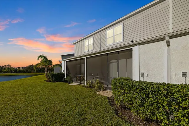 a view of a lake with houses in the back