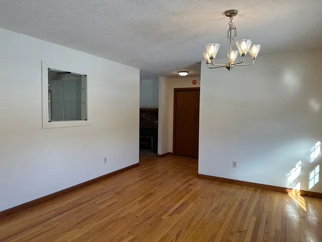a view of a livingroom with wooden floor