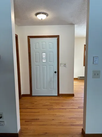 an empty room with wooden floor