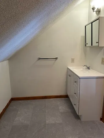 a utility room with cabinets washer and dryer