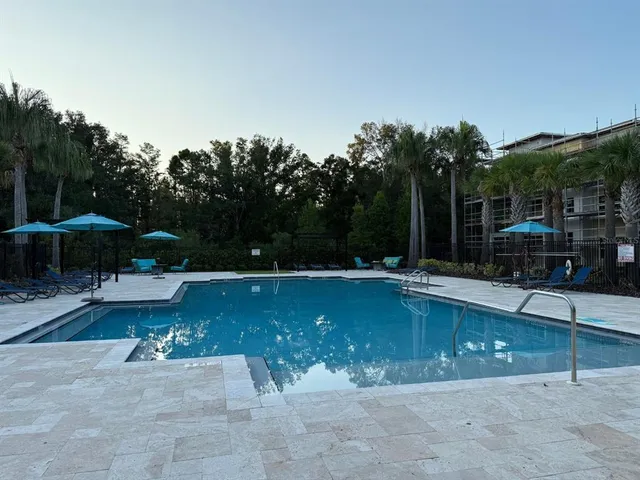 a view of a patio with a table chairs and a patio
