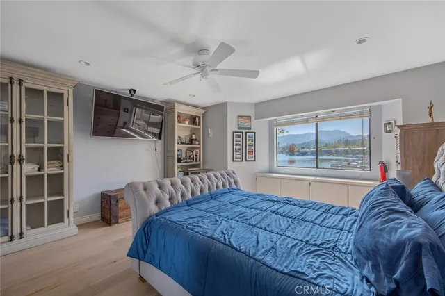 a bedroom with a large bed and a window