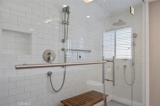 a bathroom with a bathtub and a shower