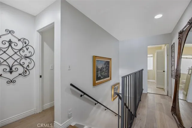a view of entryway with stairs and wooden floor