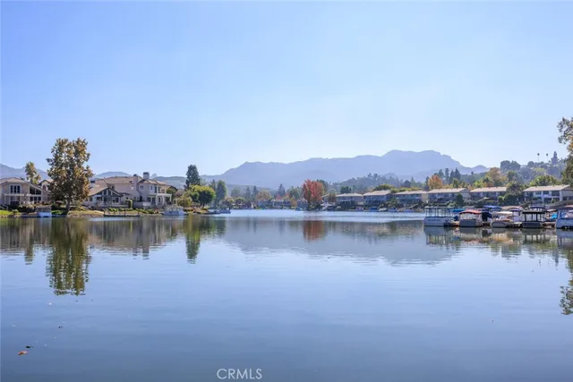 a view of a lake with houses with outdoor space