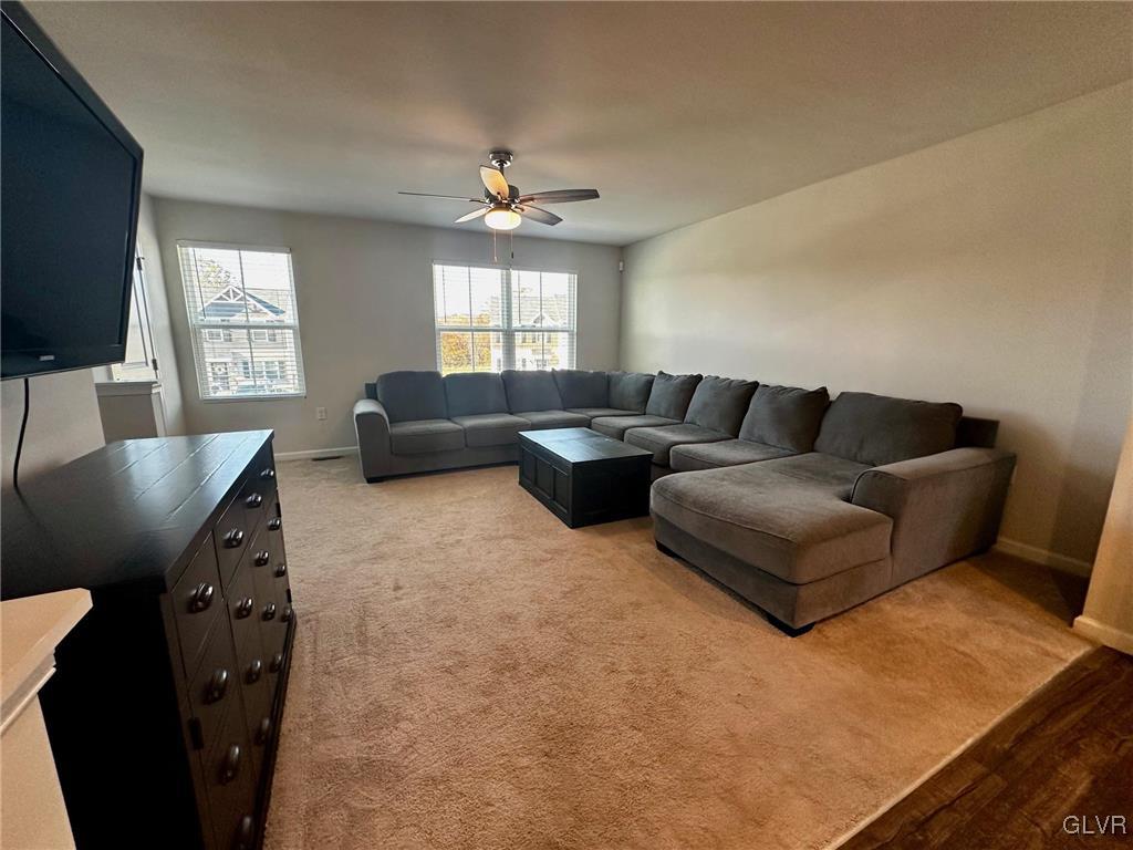 551 Delta Road Northampton, PA 18067 - Photo 15 of 43 a living room with furniture and a flat screen tv