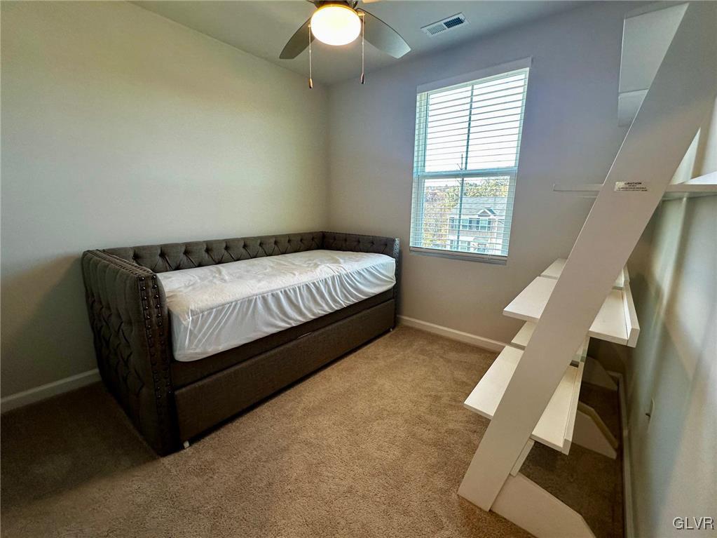 551 Delta Road Northampton, PA 18067 - Photo 21 of 43 a bed sitting in a bedroom next to a window