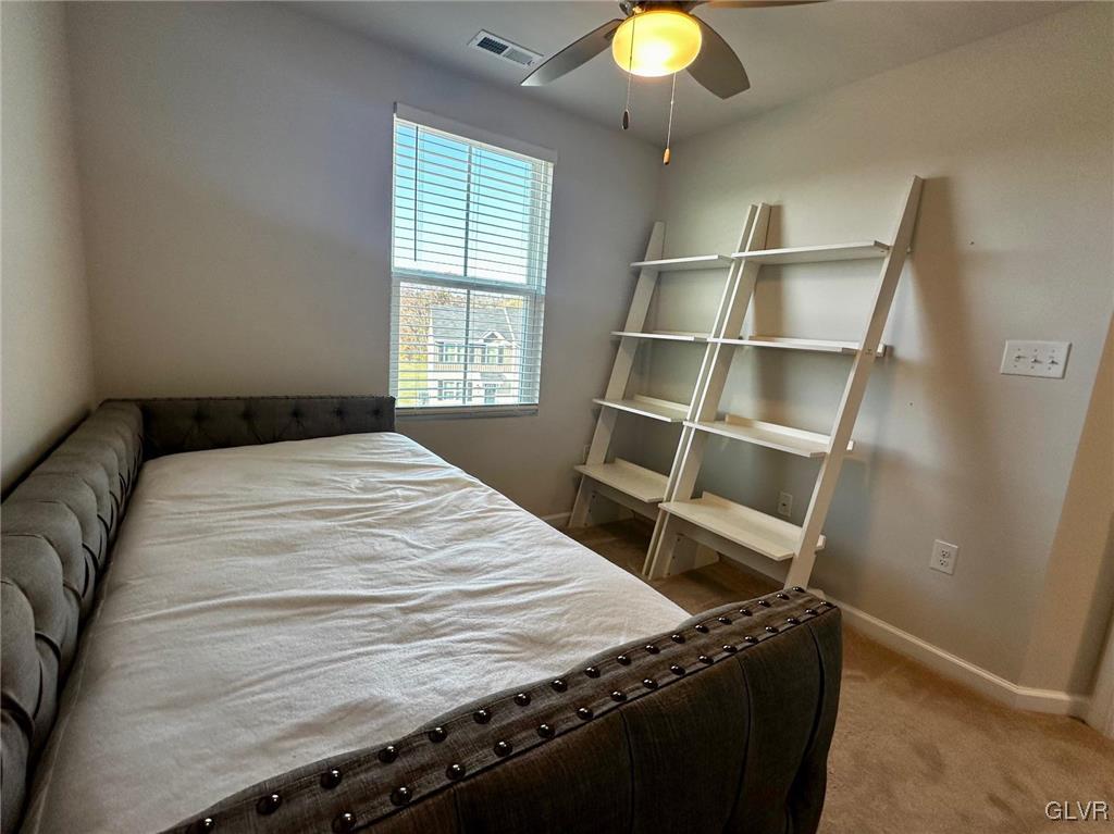 551 Delta Road Northampton, PA 18067 - Photo 22 of 43 a bed sitting in a bedroom next to a window