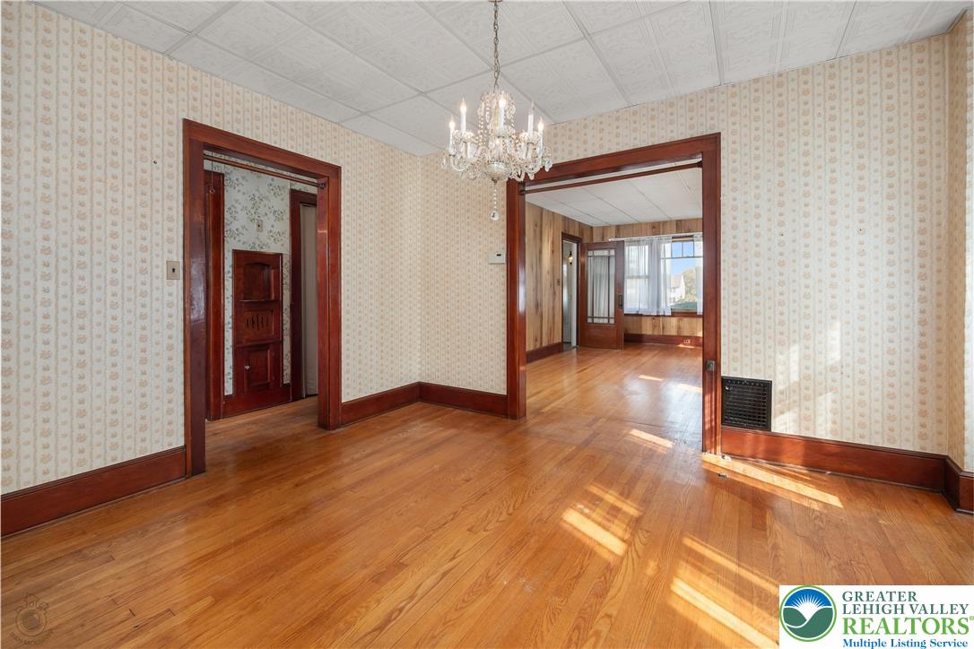 2730 Farmersville Road Bethlehem, PA 18020 - Photo 11 of 24 a view of a room with wooden floor chandelier and entryway