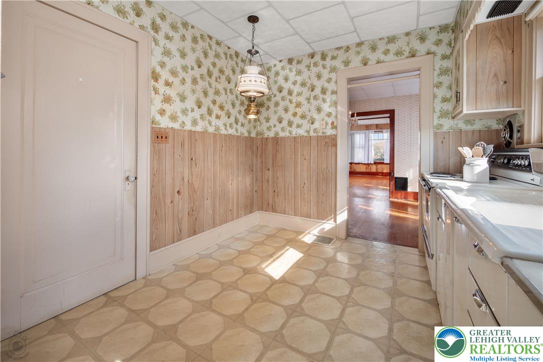 2730 Farmersville Road Bethlehem, PA 18020 - Photo 15 of 24 a kitchen with granite countertop a sink a stove and cabinets