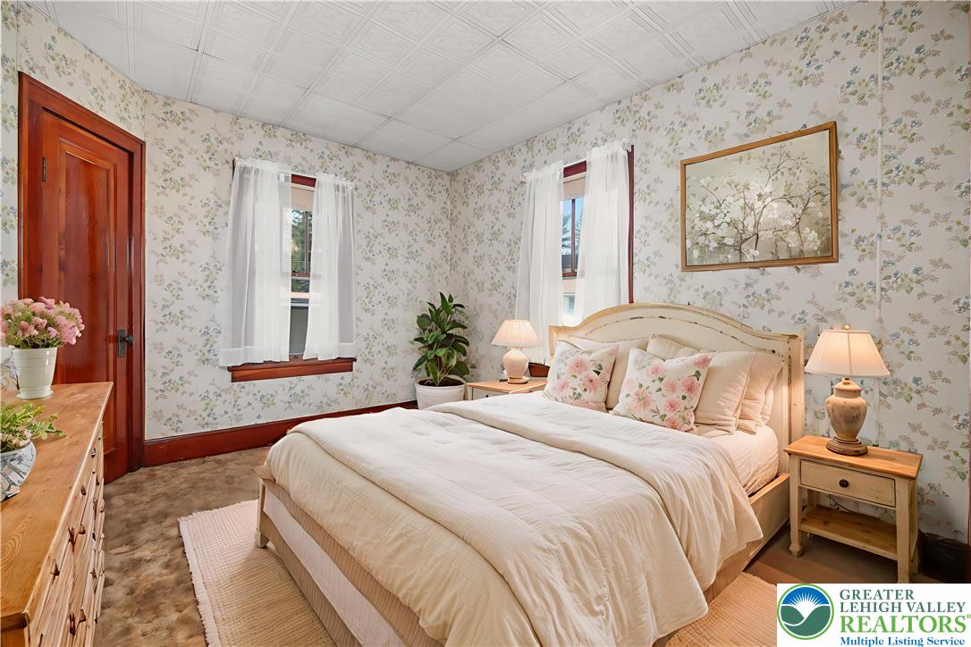 2730 Farmersville Road Bethlehem, PA 18020 - Photo 17 of 24 a bedroom with a bed and a painting on the wall