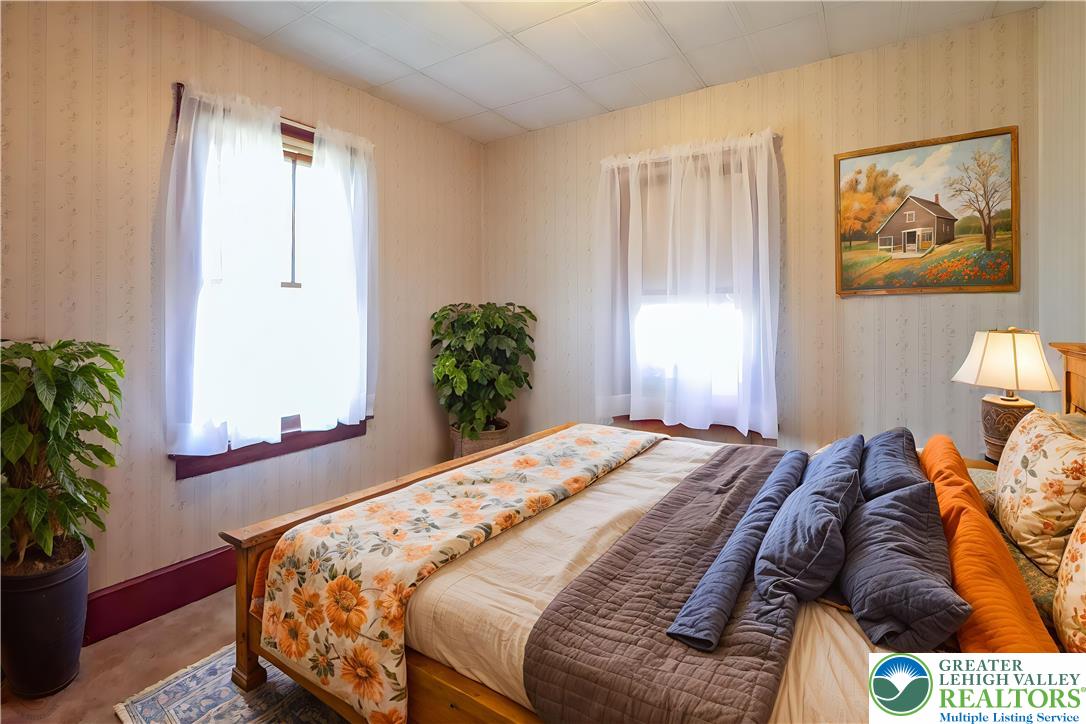 2730 Farmersville Road Bethlehem, PA 18020 - Photo 19 of 24 a bedroom with a bed and a painting on the wall