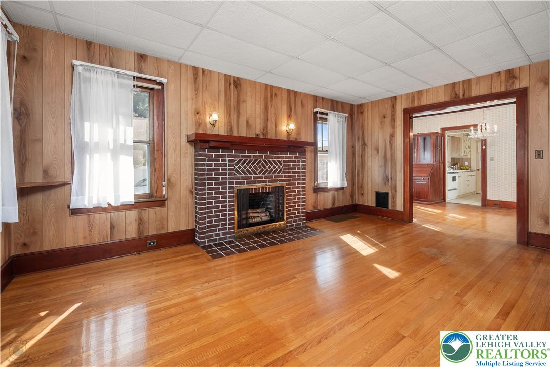 2730 Farmersville Road Bethlehem, PA 18020 - Photo 8 of 24 a view of empty room with a fireplace and windows