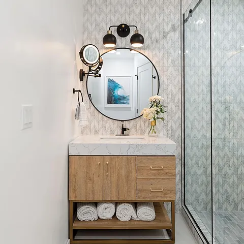a bathroom with a sink and a mirror