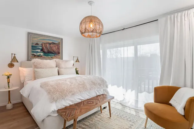 a bedroom with bed and a couch