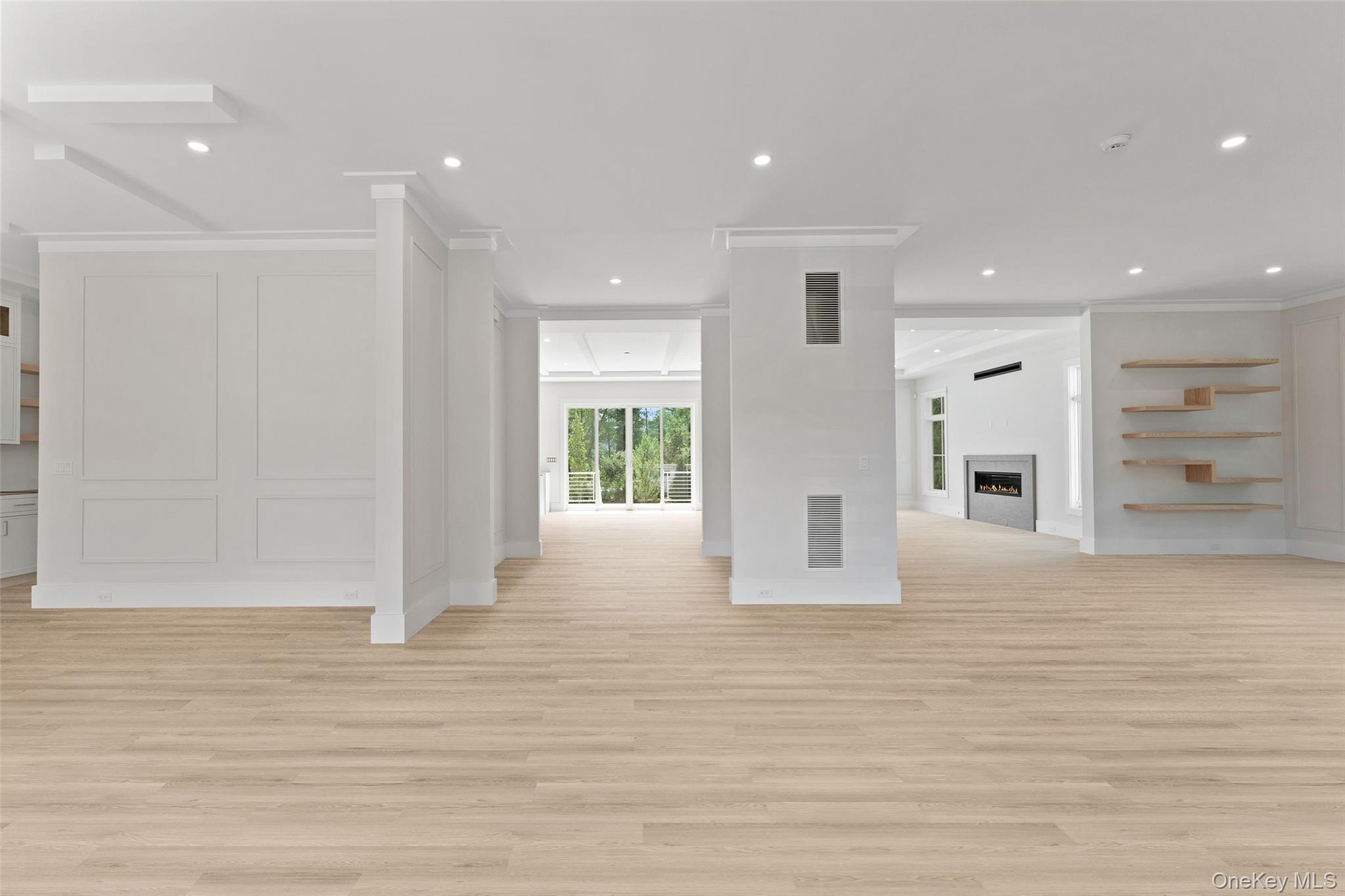 101 Carthage Road Scarsdale, NY 10583 - Photo 16 of 35 a view of an empty room with wooden floor and windows