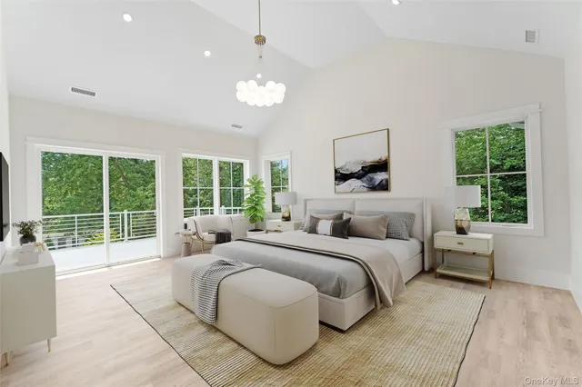 a bedroom with a large bed and a large window