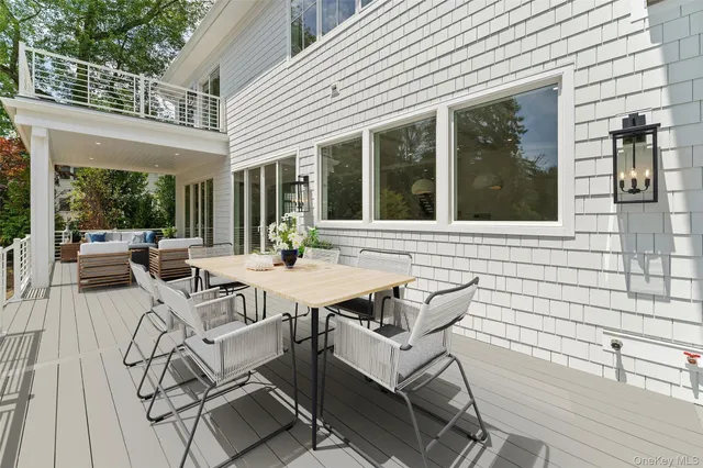 a view of a patio with table and chairs and potted plants