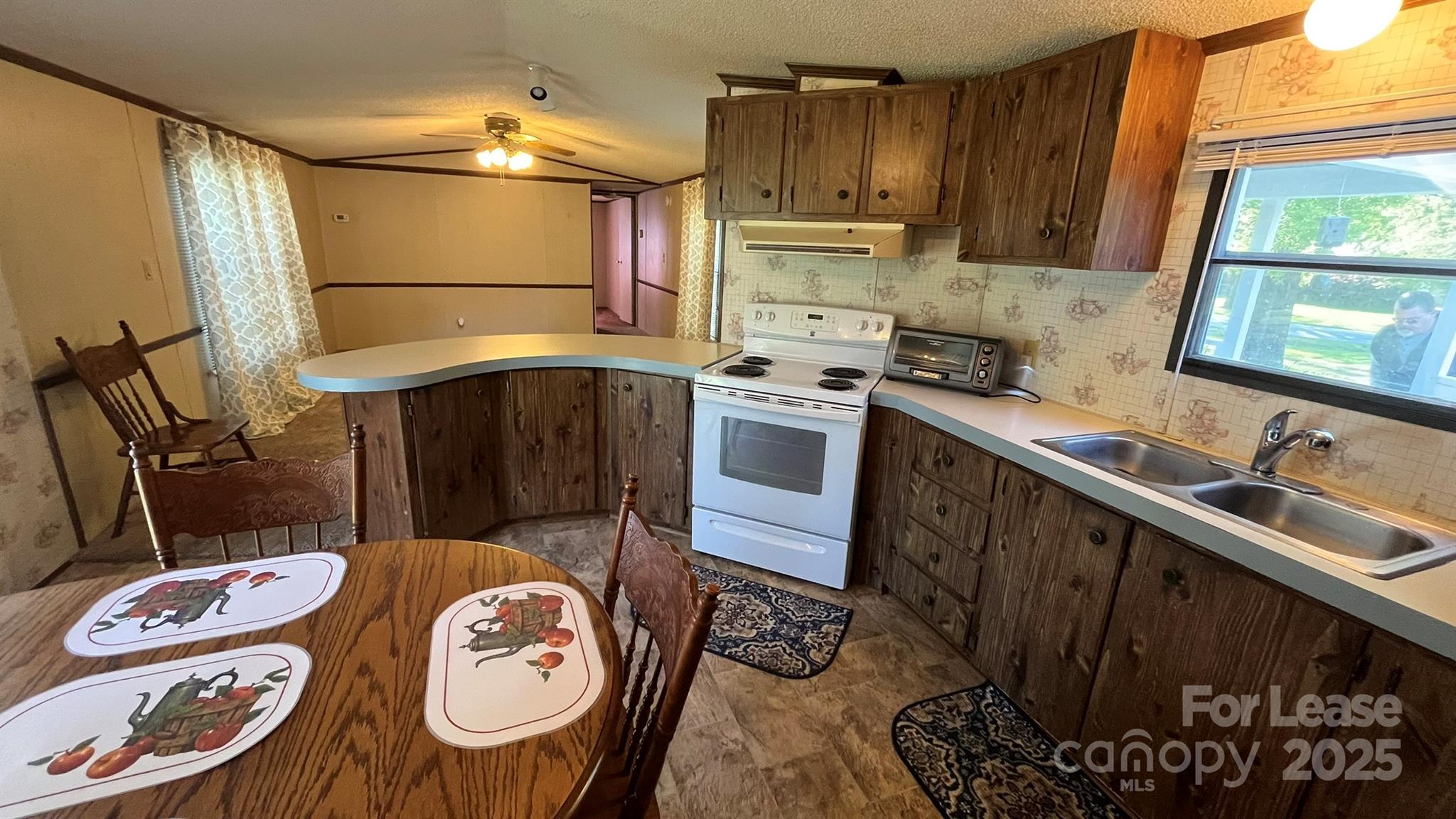 4232 Sunrise Drive Kannapolis, NC 28083 - Photo 7 of 8 a kitchen with a sink stove and refrigerator