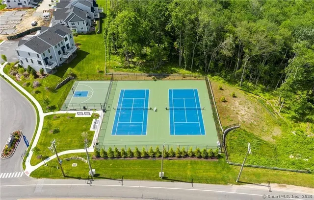 an aerial view of a house with a swimming pool