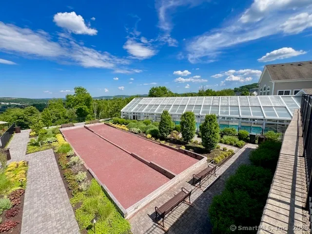 a view of a backyard with sitting area