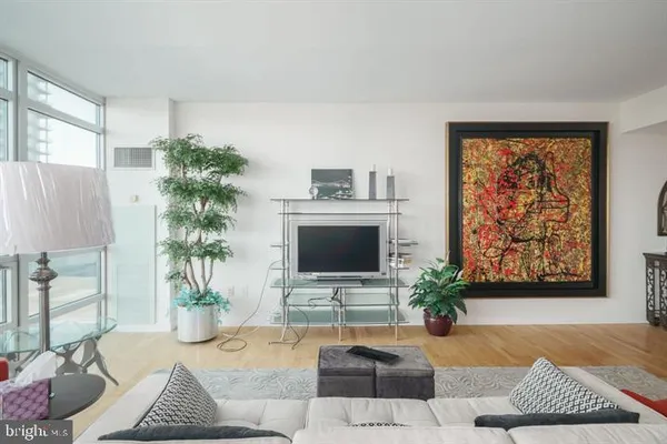 a living room with furniture and a lamp