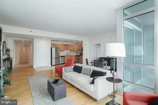 a kitchen with refrigerator cabinets and microwave