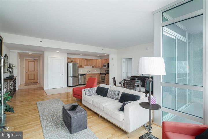 901 North Penn Street, Unit R903 Philadelphia, PA 19123 - Photo 5 of 9 a living room with furniture and a lamp