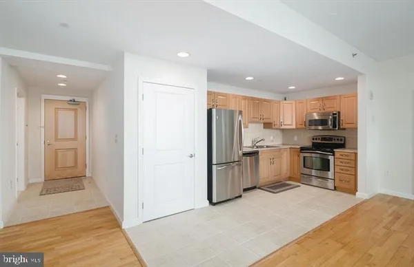 a bathroom with a sink mirror and toilet