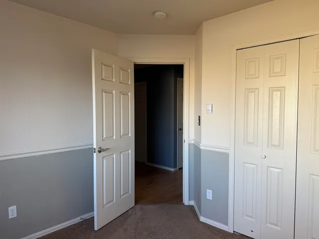 an entryway view with wooden floor